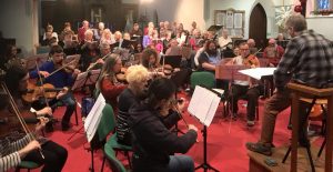 The orchestra and choir rehearsing